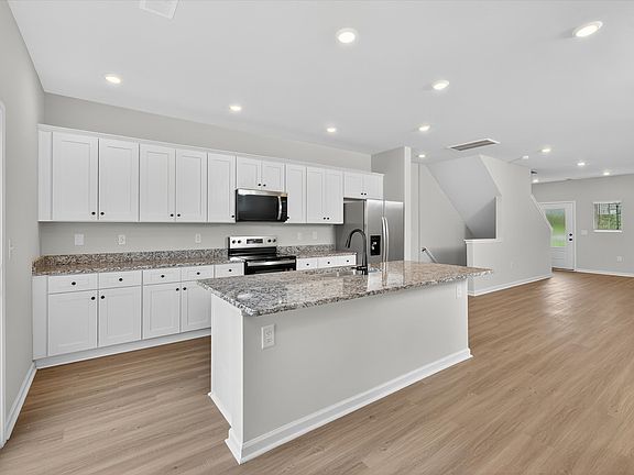 The kitchen comes with stainless-steel appliances.