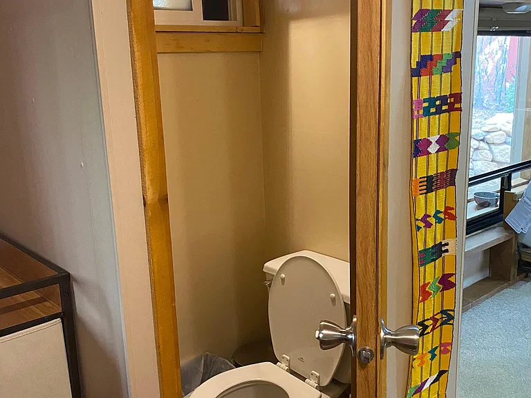 Separate toilet that is not an RV toilet, but a "real" one.