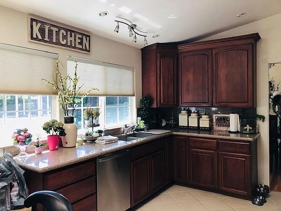 Kitchen with dishwasher, Gas range, Oven.
