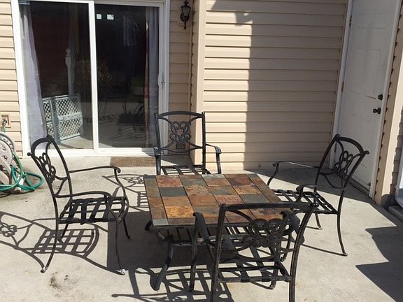 Concrete patio with storage shed