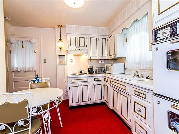 The double wall oven in the eat-in kitchen provides wonderful assistance when preparing family meals and holiday feasts.