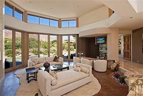 Large great room with wet bar and fireplace.