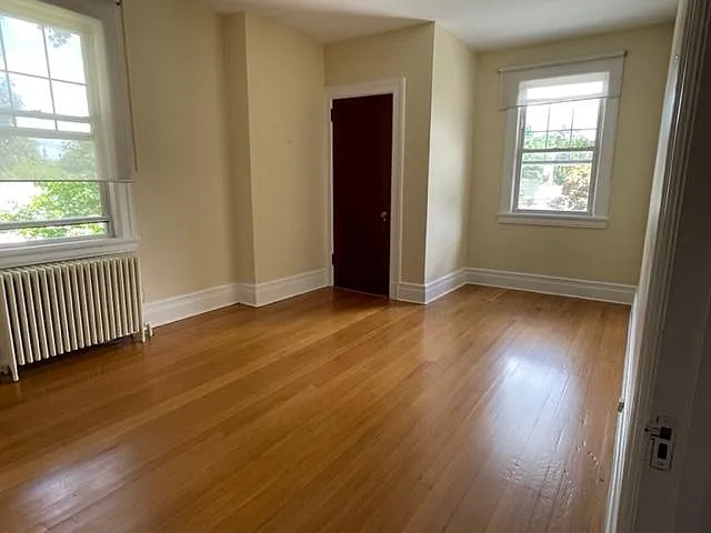 Master bedroom with alcove and walk in closet.