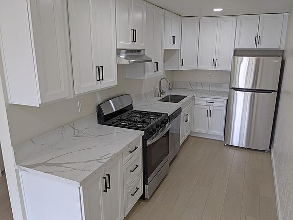 Kitchen Area with Quartz Counter Top and Stainless Steel Appliances
