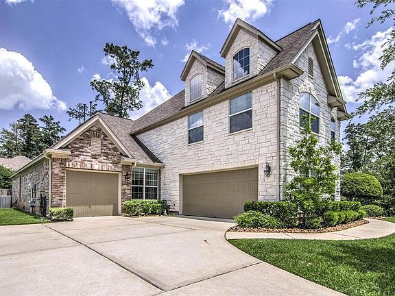 Over Sized Parking Pad and a Double and Single Attached Garage. Not a Tandum.
