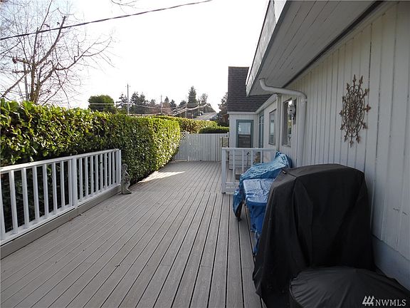 Living room with Vaulted ceilings show off amazing views.  Slider to large deck with Trex decking.