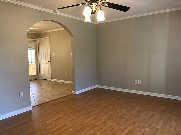 View from family room to eating nook and kitchen. No carpet. LVP and tile floors.