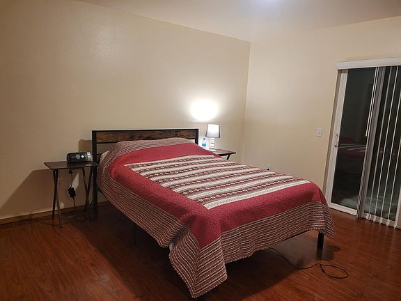 Master bedroom with slider to patio.