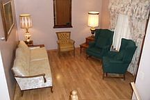 Main floor living room
						:
						This living room serves as the main entrance to the house.