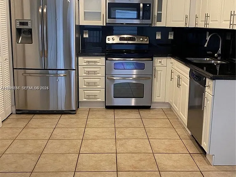 8811 SW 132nd Pl #309CW — Photo 1
