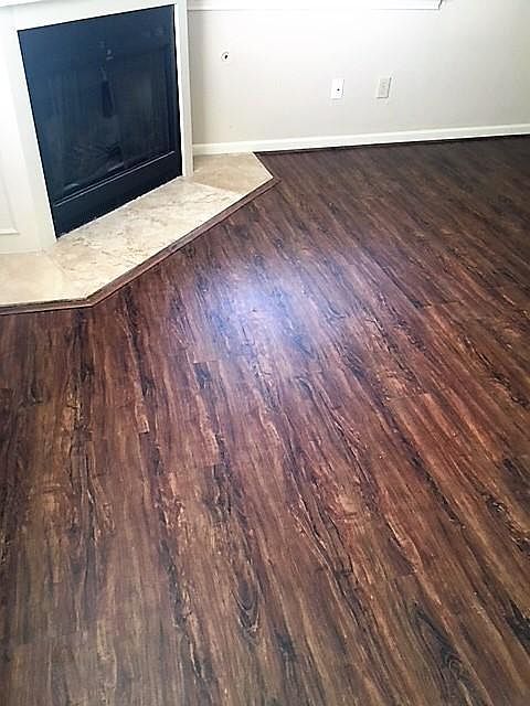 New "wood look" vinyl plank flooring in living room.