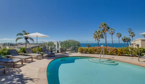 Take in the amazing ocean views while hanging out by the pool - Ocean House on Prospect Apartment Homes