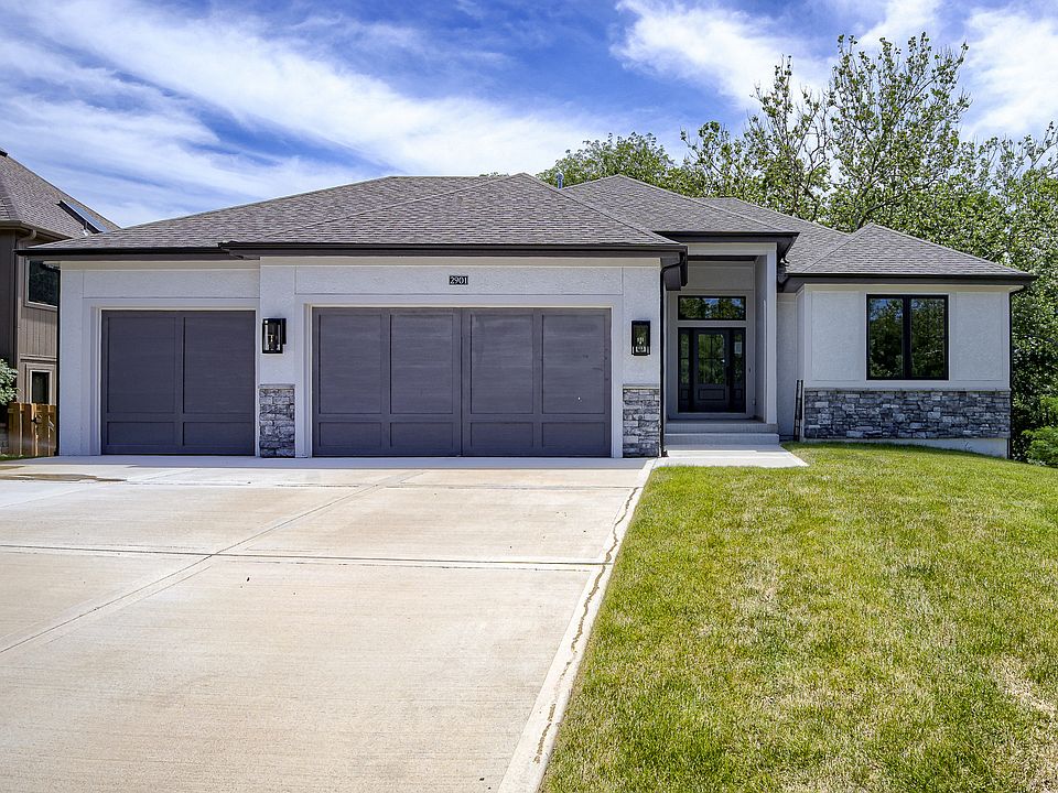 Front with stucco and stone trim