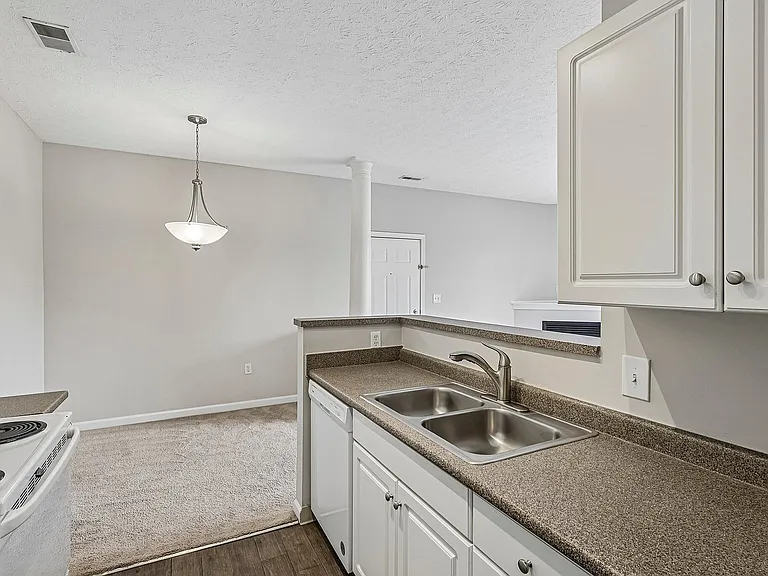 Charming kitchen view showcasing modern countertops