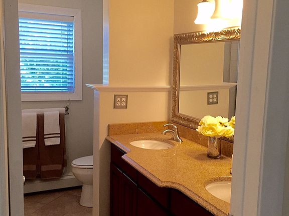 Bathroom with double sinks and granite countertops