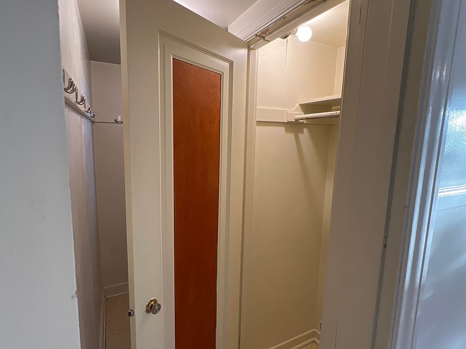 Coat closet just inside the pantry