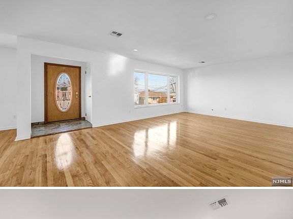 Interior of upstairs, main part of the home. Living room and dining room.