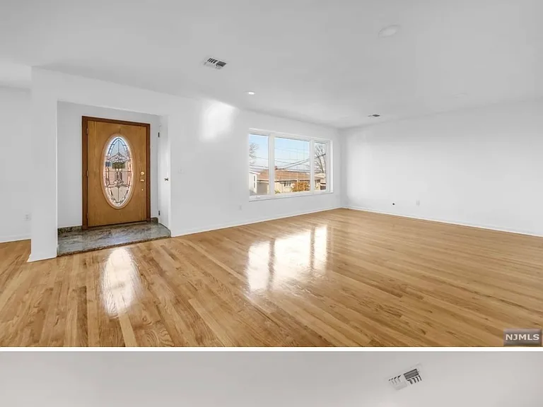 Interior of upstairs, main part of the home. Living room and dining room.