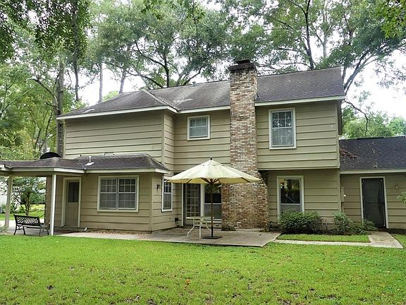 Back of the house has a covered breezeway to the garage and nice sized patio.  Exterior doors directly to the back yard from the Laundry Room, Family Room, and Study.