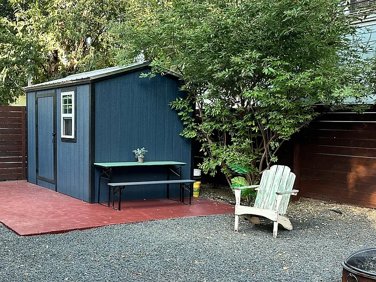 the small shed is solely for use by the owner but enjoy the spacious backyard with firepit, a BBQ Weber is also available for your use