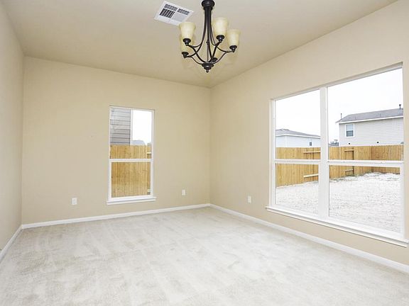 Formal dining room with lots of windows and high ceilings!