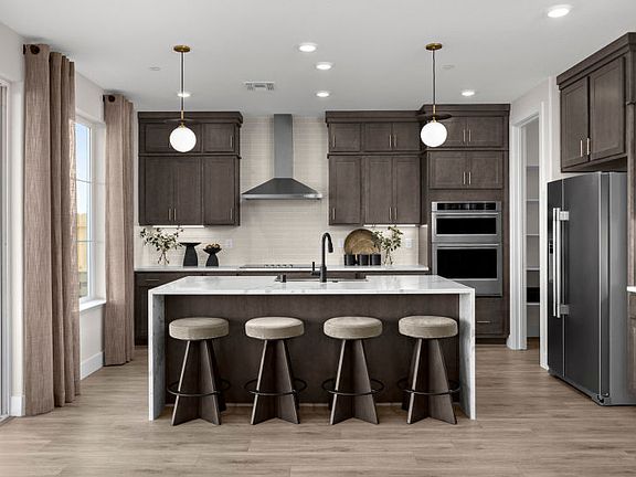 Kitchen with large waterfall edge island