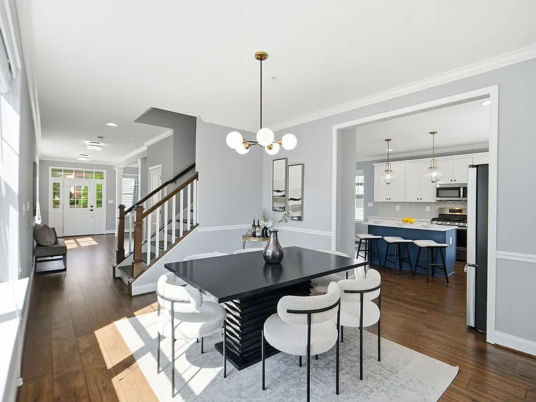 Beautiful dining room opening to kitchen and back porch, perfect for family dinners!