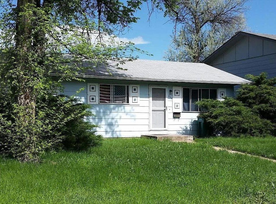 Corner lot with mature landscape and healthy lawn. Street parking.
