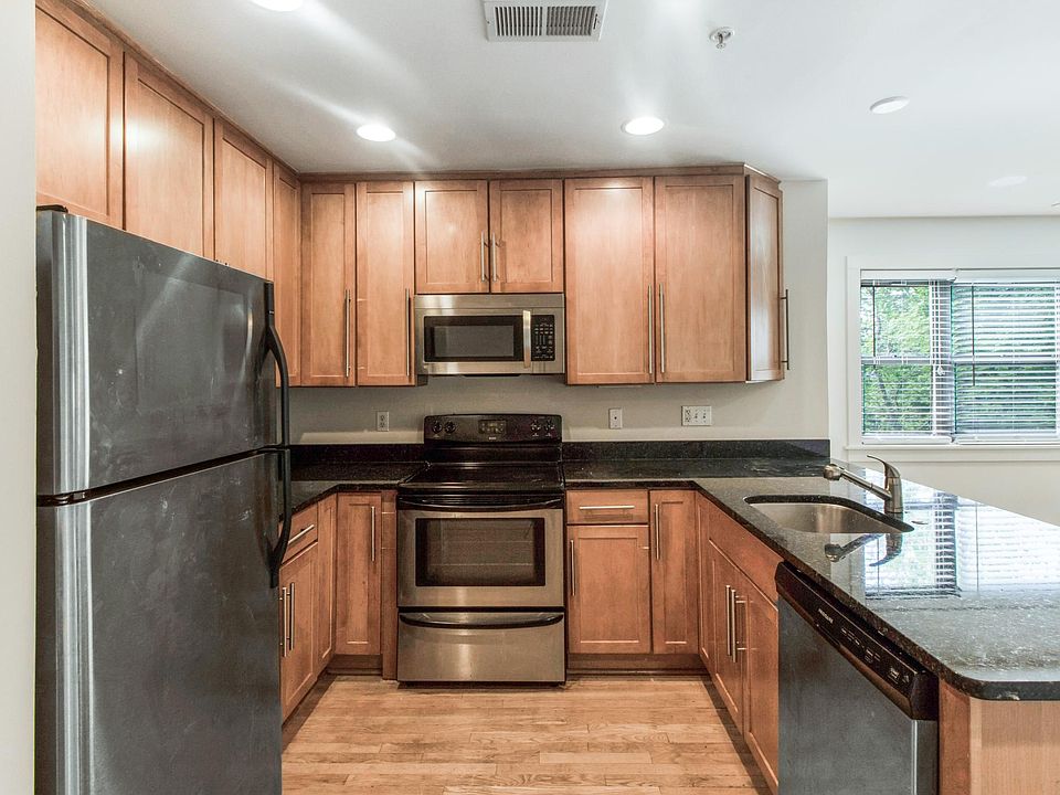 Kitchen with stainless appliances including a dishwasher.