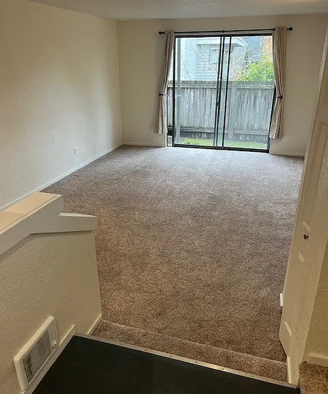Living / Great Room with Slider out to Patio and Private Backyard