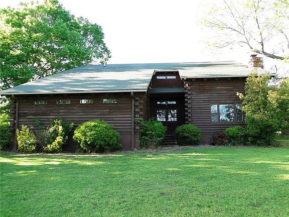 INVITING 4 BR, 3 Bath LOG HOME, 2,936+- Sq. Ft. of living area plus a 2 car garage.