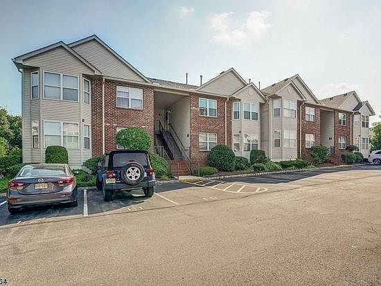 Building front view and assigned parking lot