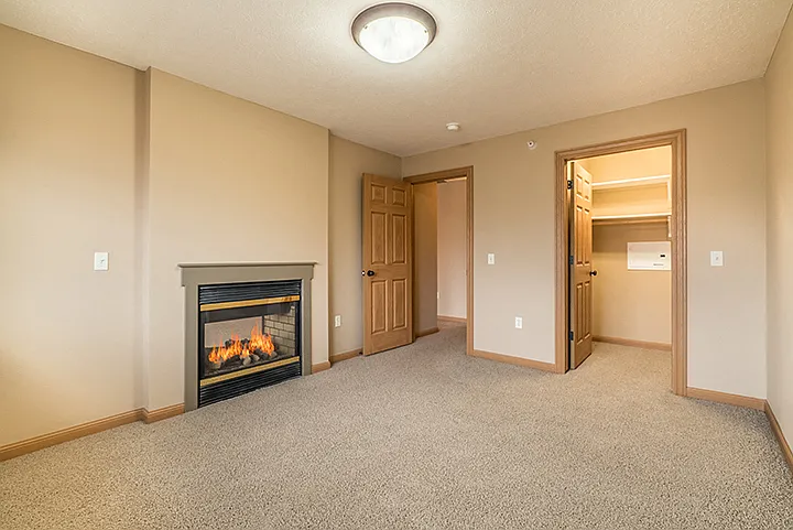Our 1-bedroom Aura features a two-way fireplace in the living room and bedroom, giving you a touch of warmth throughout your whole home.
