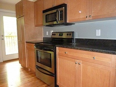 stainless steel appliances...electric oven/range, refrigerator, built-in microwave