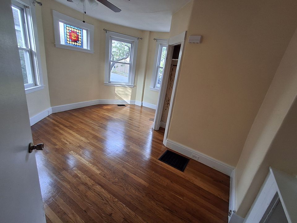 Bedroom #1: Ceiling fan, hardwood floors, stained glass window in addition to 3 regular windows. Has built-in shelves and drawers in addition to closet.