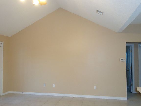 South wall of living room with door to back yard