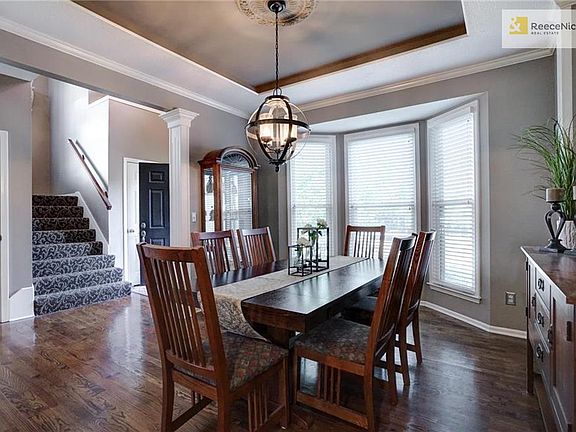 Tray ceilings and architectural columns inspire elegance.