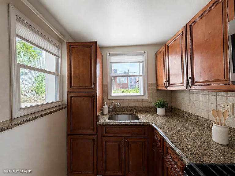 windows throughout, including one over the sink overlooking the private backyard