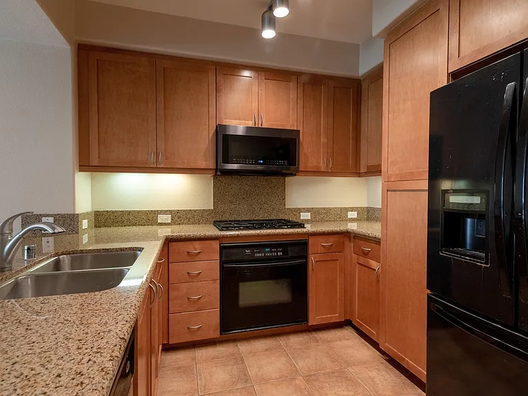 Large kitchen with new appliances and granite counter top