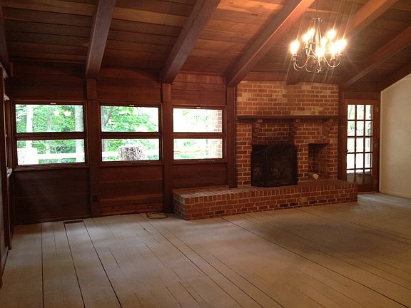 Living room with brick woodburning fireplace