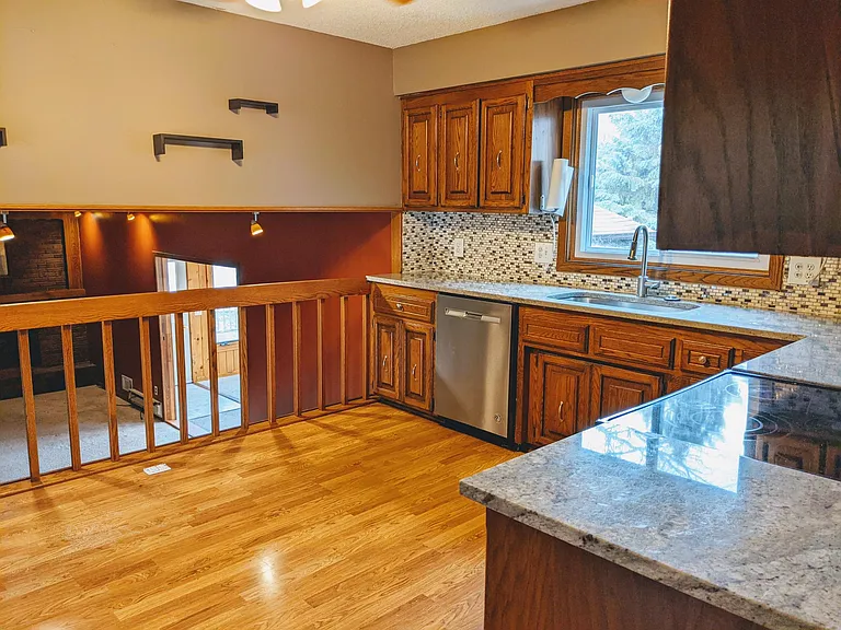 Kitchen with view to backyard and living room 1