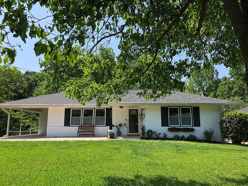 Front of house (framed by dogwood tree)