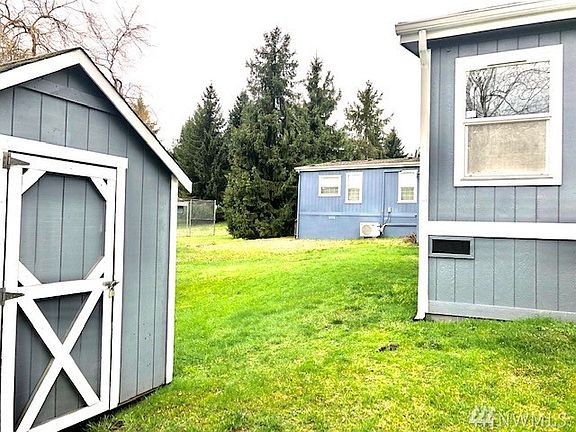 Roomy back yard - backs up to the sport court where you see the chain link fence