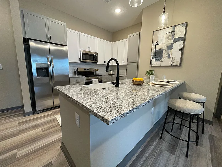 Explore this contemporary kitchen featuring chic design elements and functional layout.
