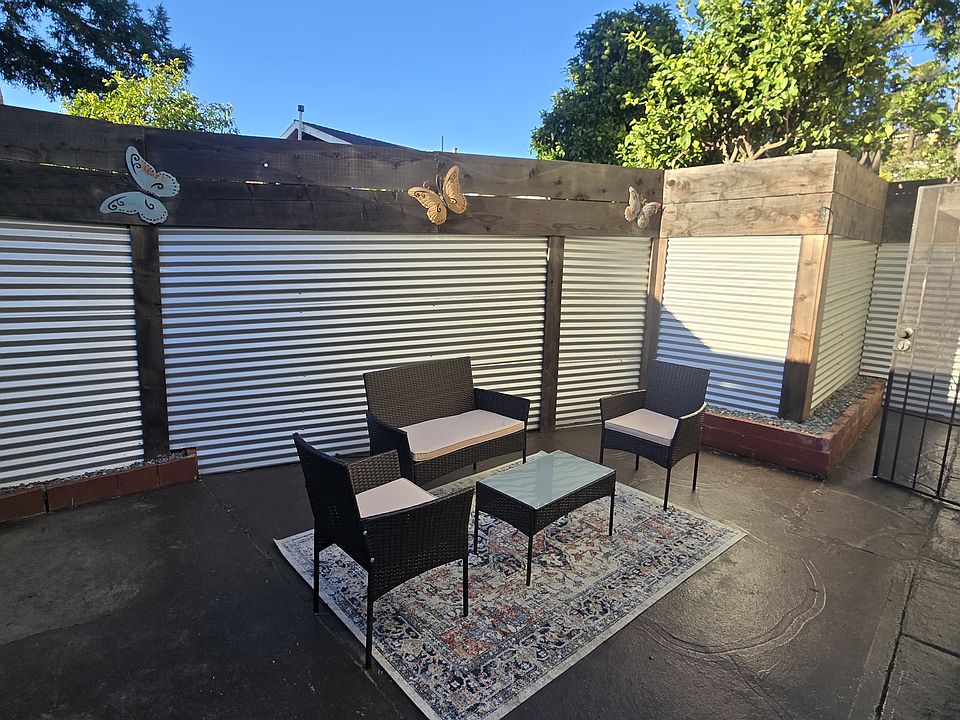 Private, gated entry leading to a fully enclosed patio with outdoor seating _ a quiet space for morning coffee or relaxing at the end of the day.