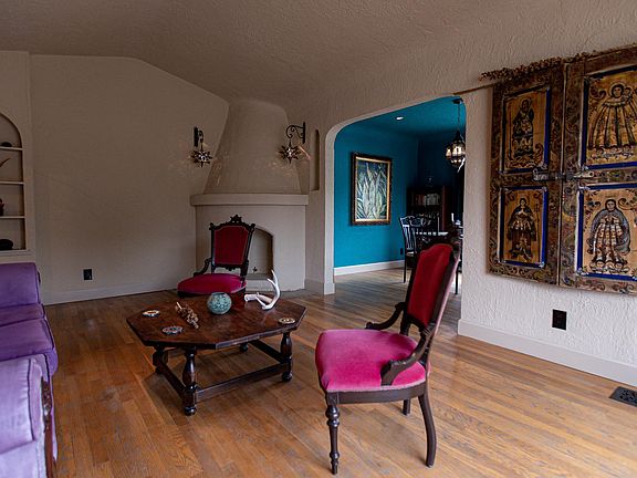 The living room of this 1940 home features original furniture and wood floors.