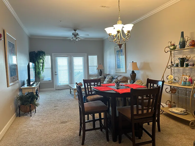 Dining area and living room with Door going out onto the balcony