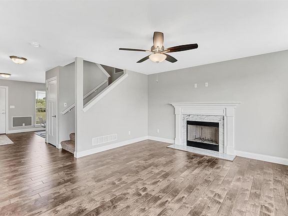 wood burning fireplace with marble surround