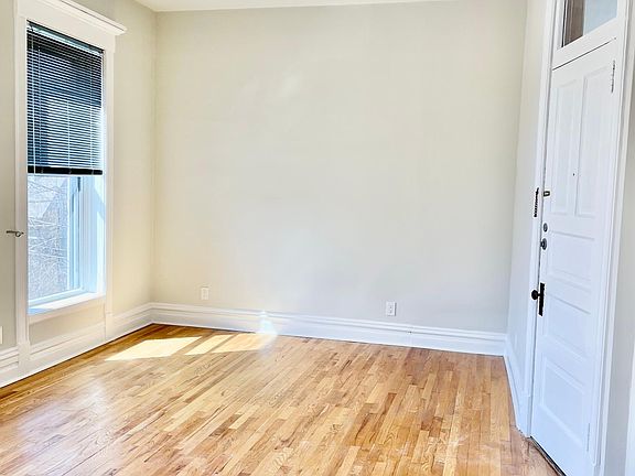 Front Living Room Facing West, with front entrance door on right.
