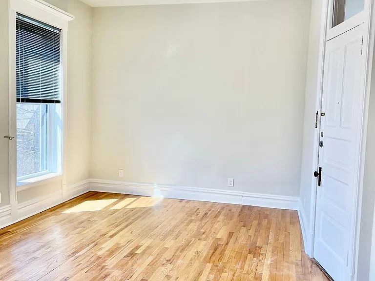 Front Living Room Facing West, with front entrance door on right.
